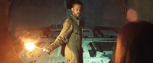 Dominic Monaghan as Robinson in the sci-fi thriller film 