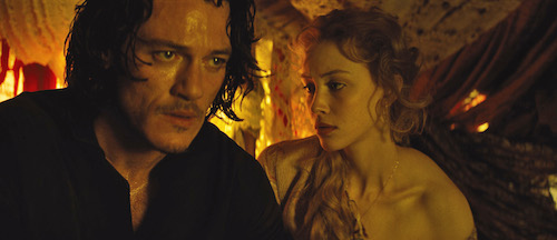 Vlad (LUKE EVANS) seeks compassion from wife Mirena (SARAH GADON) in Dracula Untold, the origin story of the man who became Dracula. Gary Shore directs and Michael De Luca produces the epic action-adventure Photo Credit: Universal Pictures Copyright: 2014 Universal Studios. ALL RIGHTS RESERVED. Vlad (LUKE EVANS) seeks compassion from wife Mirena (SARAH GADON) in Dracula Untold, the origin story of the man who became Dracula. Gary Shore directs and Michael De Luca produces the epic action-adventure Photo Credit: Universal Pictures Copyright: 2014 Universal Studios. ALL RIGHTS RESERVED.