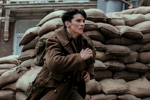 FIONN WHITEHEAD as Tommy in the Warner Bros. Pictures action thriller DUNKIRK, a Warner Bros. Pictures release. Photo credit: Melinda Sue Gordon. FIONN WHITEHEAD as Tommy in the Warner Bros. Pictures action thriller DUNKIRK, a Warner Bros. Pictures release. Photo credit: Melinda Sue Gordon.