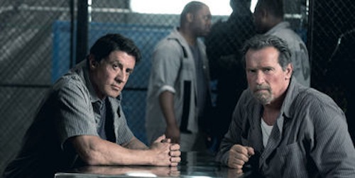 Sylvester Stallone and Arnold Schwarzenegger in Escape Plan. 2013 Summit Entertainment.