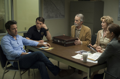 Nick (Ben Affleck, left) is questioned about the disappearance of his wife, Amy, by Detectives Boney (Kim Dickens, far right) and Gilpin (Patrick Fugit, in dark shirt), as Nickâs in-laws Marybeth and Rand Elliott (Lisa Barnes, David Clennon) look on. Photo: Merrick Morton - TM and 2014 Twentieth Century Fox and Regency Enterprises. All Rights Reserved. Not for sale or duplication. As her marriage flounders, Amy (Rosamund Pike) expresses her thoughts in a diary. Photo: Merrick Morton - TM and 2014 Twentieth Century Fox and Regency Enterprises. All Rights Reserved. Not for sale or duplication.