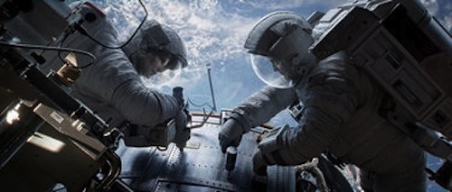 Sandra Bullock as Dr. Ryan Stone and George Clooney as Matt Kowalsky in Gravity. 2013 Warner Bros. Sandra Bullock as Dr. Ryan Stone and George Clooney as Matt Kowalsky in Gravity. 2013 Warner Bros.