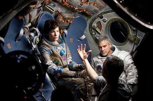 Sandra Bullock, George Clooney and Director Alfonso Cuaron on the set of Gravity. 2013 Murdo Macleod / Warner Bros