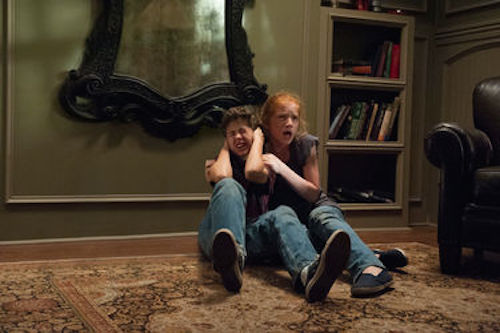 Garrett Ryan and Annalise Basso in Oculus. 2014 Relativity Media.