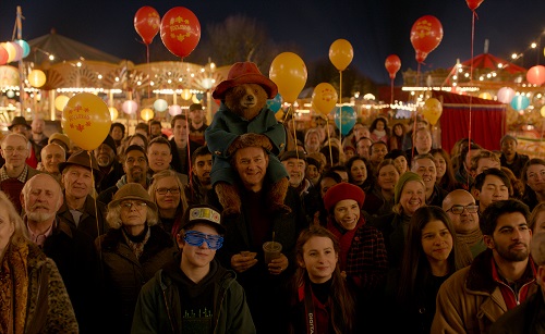 (Front/center L-R) JULIE WALTERS as Mrs. Bird, SAMUEL JOSLIN as Jonathan Brown, Paddington voiced by BEN WHISHAW, HUGH BONNEVILLE as Henry Brown, MADELEINE HARRIS as Judy Brown and SALLY HAWKINS as Mary Brown in the family adventure PADDINGTON 2 from Warner Bros. Pictures and STUDIOCANAL, in association with Anton Capital Entertainment S.C.A., a Warner Bros. Pictures release. Photo Courtesy of Warner Bros. Pictures.