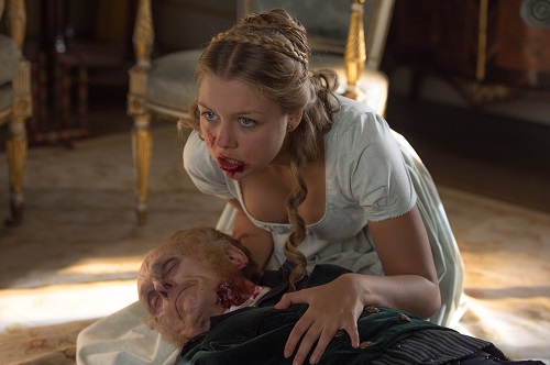 Annabelle (Jess Radomska) chewing her grandfather in Screen Gems' PRIDE AND PREJUDICE AND ZOMBIES. Copyright 2015 CTMG, Inc. All Rights Reserved.