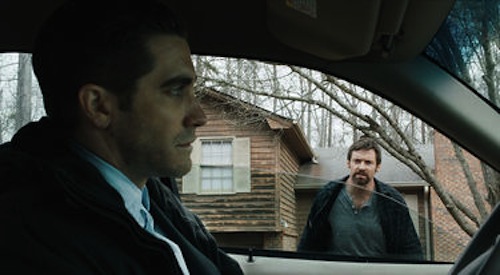 Jake Gyllenhaal as Detective Loki and Hugh Jackman as Keller Dover in Prisoners. 2013 Warner Brothers.