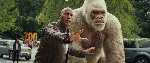 (L-R) DWAYNE JOHNSON as Davis Okoye and JASON LILES as George in New Line Cinema's and ASAP Entertainment's action adventure RAMPAGE, a Warner Bros. Pictures release. Photo Courtesy of Warner Bros. Pictures, © 2018 WARNER BROS. ENTERTAINMENT INC.