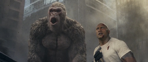 (L-R) JASON LILES as George and DWAYNE JOHNSON as Davis Okoye in New Line Cinema's and ASAP Entertainment's action adventure RAMPAGE, a Warner Bros. Pictures release. Photo Courtesy of Warner Bros. Pictures, © 2018 WARNER BROS. ENTERTAINMENT INC.