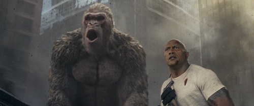 (L-R) JASON LILES as George and DWAYNE JOHNSON as Davis Okoye in New Line Cinema's and ASAP Entertainment's action adventure RAMPAGE, a Warner Bros. Pictures release. Photo Courtesy of Warner Bros. Pictures, © 2018 WARNER BROS. ENTERTAINMENT INC. (L-R) JASON LILES as George and DWAYNE JOHNSON as Davis Okoye in New Line Cinema's and ASAP Entertainment's action adventure RAMPAGE, a Warner Bros. Pictures release. Photo Courtesy of Warner Bros. Pictures, © 2018 WARNER BROS. ENTERTAINMENT INC.