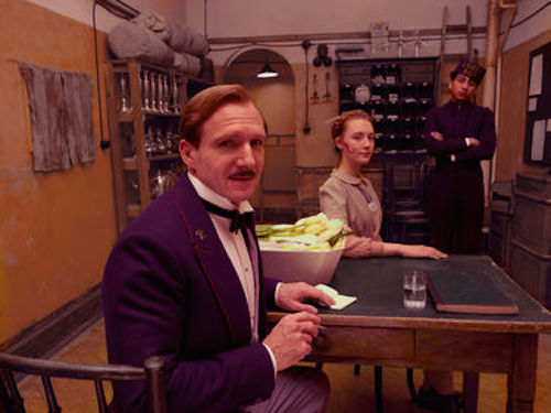 Ralph Fiennes as M. Gustave, Saoirse Ronan as Agatha and Tony Revolori as Zero in The Grand Budapest Hotel. 2014 Fox Seachlight Pictures.