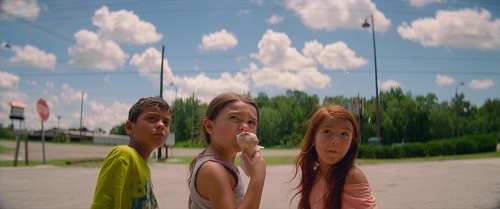 Christopher Rivera, Brooklynn Prince, and Valeria Cotto in The Florida Project. Photo courtesy cf A24.