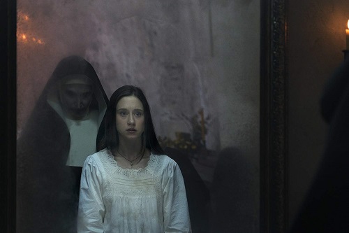 (L-R) BONNIE AARONS as The Nun and TAISSA FARMIGA as Sister Irene in New Line Cinema's horror film THE NUN, a Warner Bros. Pictures release. Photo by Cos Aelenei.