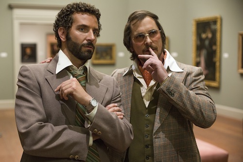 Richie Dimaso (Bradley Cooper, left) and Irving Rosenfeld (Christian Bale) talk in a gallery at the Frick Museum in Columbia Pictures' AMERICAN HUSTLE. PHOTO BY:	Francois Duhamel COPYRIGHT:	© 2013 Annapurna Productions LLC All Rights Reserved.