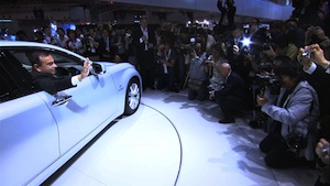 Carlos Gsohn in a Nissan Leaf at a press event