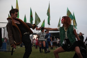 Luke Treadaway as Adam and Natalia Tena as Morello handcuffed together during the filming of Tonight You're Mine.