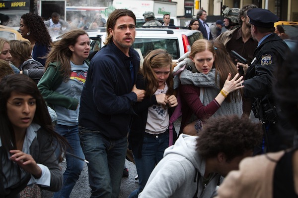 Left to right: Brad Pitt is Gerry Lane, Abigail Hargrove is Rachel Lane, and Mireille Enos is Karin Lane in WORLD WAR Z, from Paramount Pictures and Skydance Productions in association with Hemisphere Media Capital and GK Films.