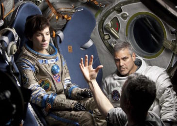 Sandra Bullock, Alfonso Cuarón, and George Clooney on the set of Gravity.