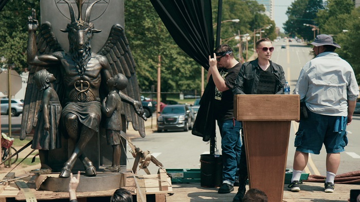 Lucien Greaves delivering a speech in front of the state capitol building in Little Rock, AR in HAIL SATAN?, a Magnolia Pictures release. Photo courtesy of Magnolia Pictures.